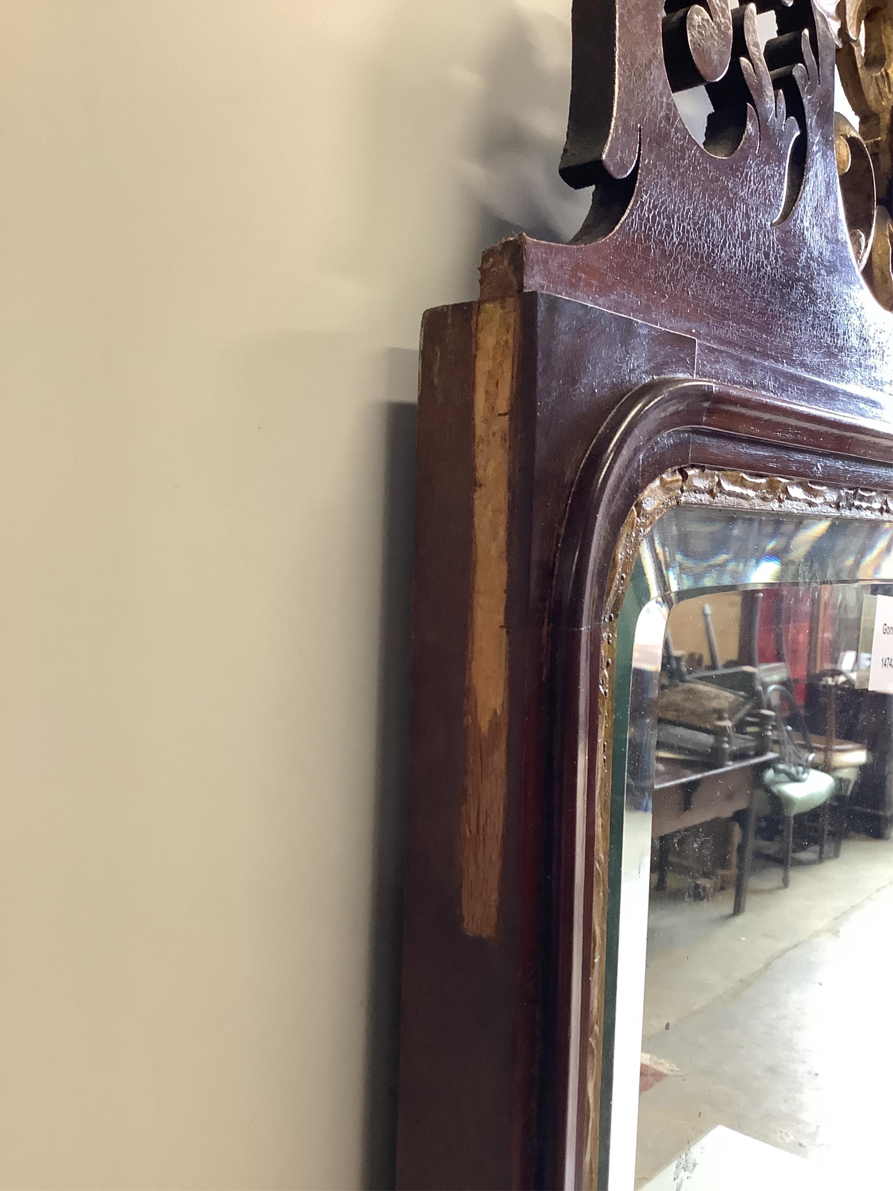An Edwardian inlaid mahogany fret cut wall mirror, width 50cm, height 91cm. Condition - poor